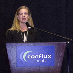 Image of Anna Murray, vice president of sustainability for real estate investment advisors Bentall Kennedy, speaking at the Conflux Canada conference in Ottawa.