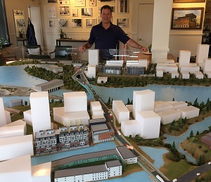 PHOTO: Jeff Westeinde, president of Theia Partners, stands with a 3D model of the Zibi development in Ottawa and Gatineau.